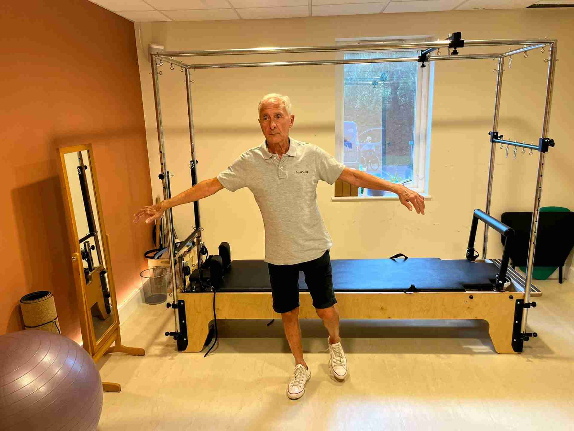 Barry stands balanced on his right leg with his rams stretched out either side.