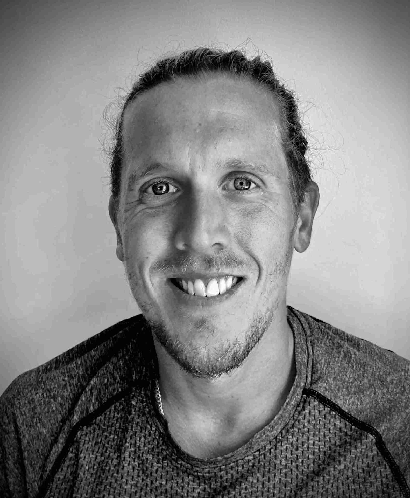 black and white headshot of tom taverner