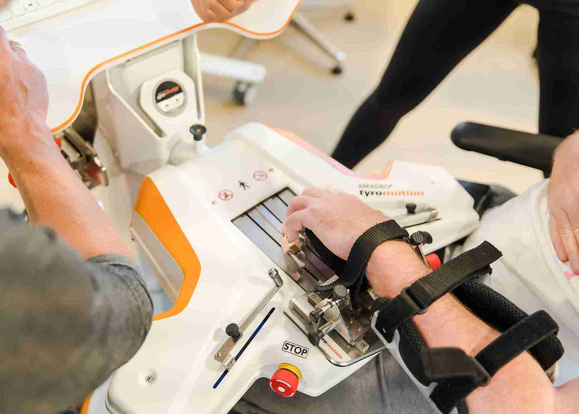 close up image of right hand using upperlimb rehab device the pablo