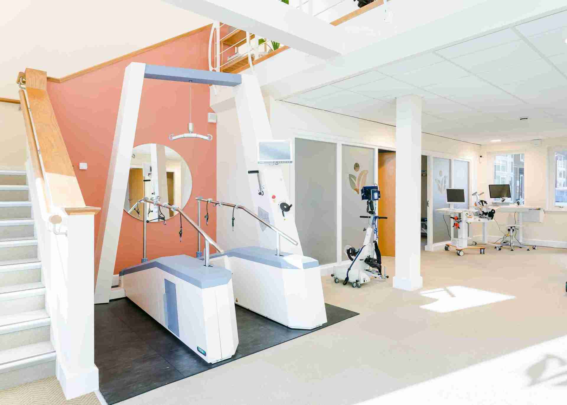 image of the ground floor at Vim Health, you can see teo lower limb devices the lyra and the FES bike. and upperlimb devices the amadeo and pablo in the corner
