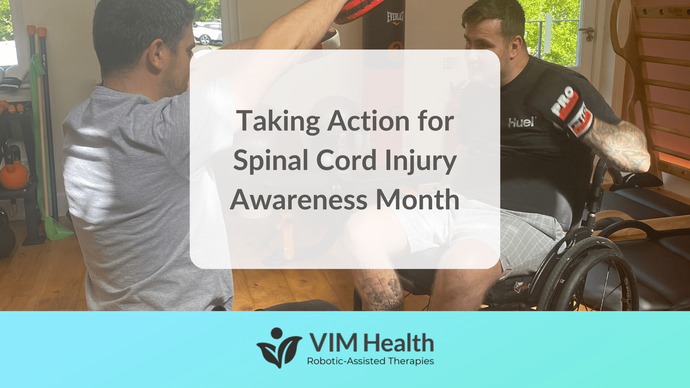 Shaun is sat in his wheel chair whilst having a boxing session with Physio Tom Freeman. There is text in a white box over this that reads: Taking Action for Spinal Cord Injury Awareness Month