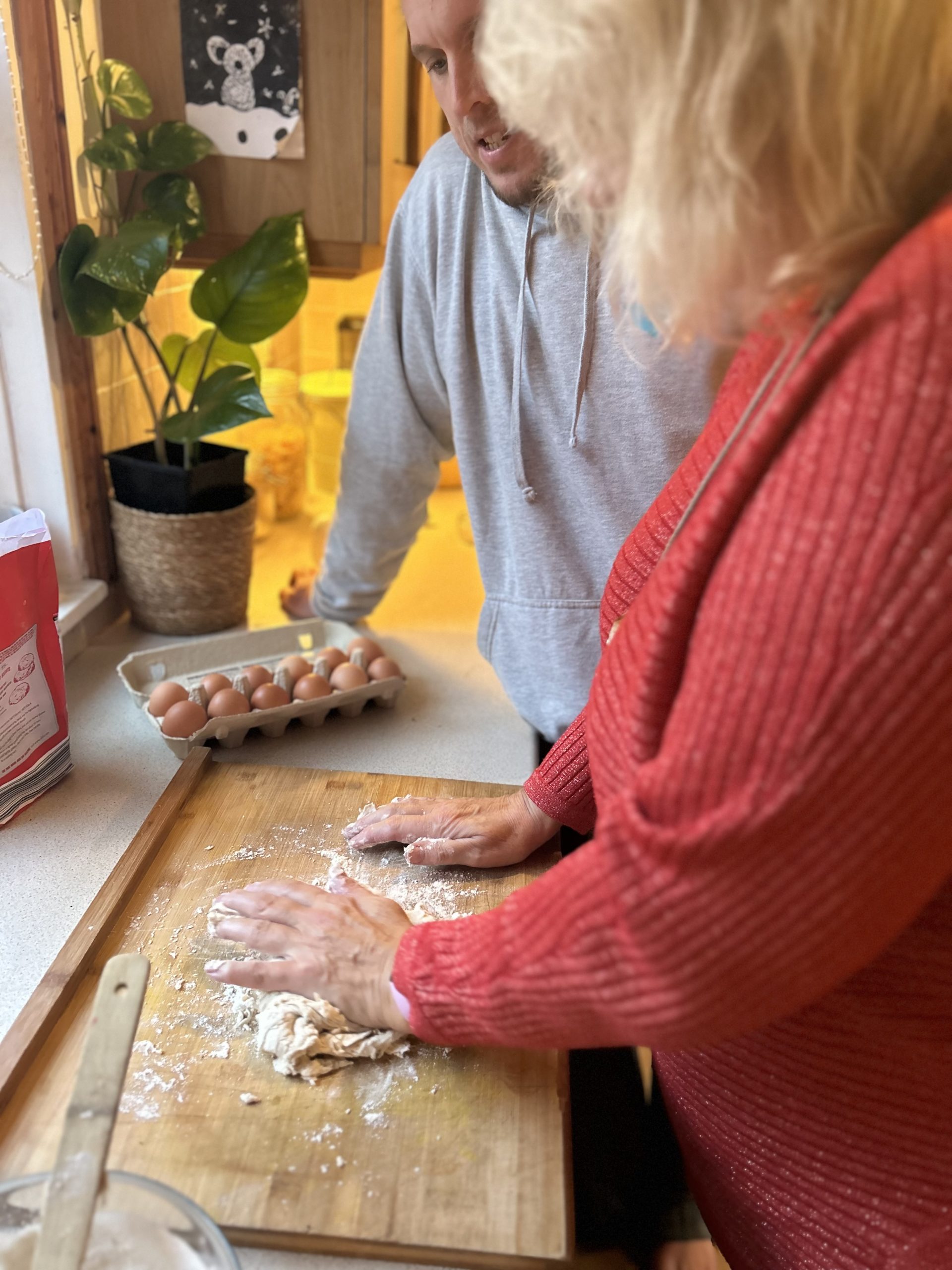 A Julie kneading dough with her left hand as part of her rehabilitation exercises at home.
