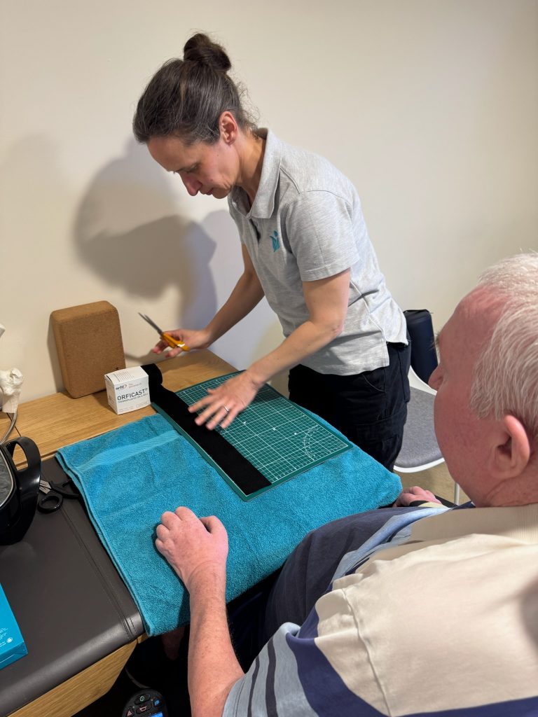 OT rachel is preparing a splint for Peter